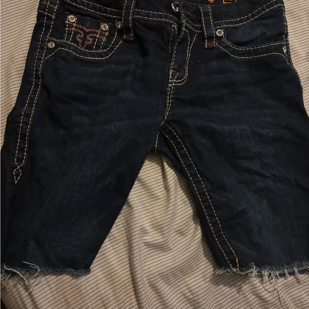 Rock Revival Blue Jeans with Contrast Stitching and Raw Hem